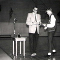 Coach Myron presents Bucky Dale with his basketball letter and awards. Bucky was Capt. of the team.